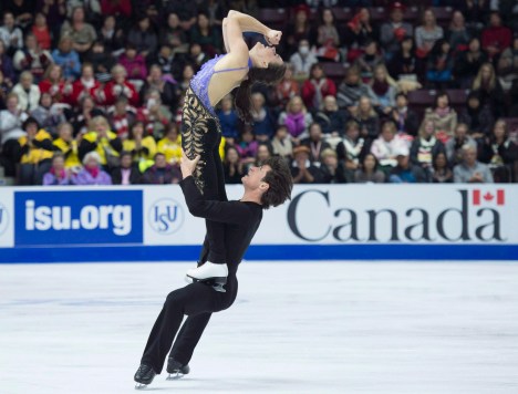 Tessa Virtue and Scott Moir of Canada perform in the ice dance short program during the 2016 Skate Canada International competition in Mississauga, Ont., on Friday, October 28, 2016. THE CANADIAN PRESS/Nathan Denette