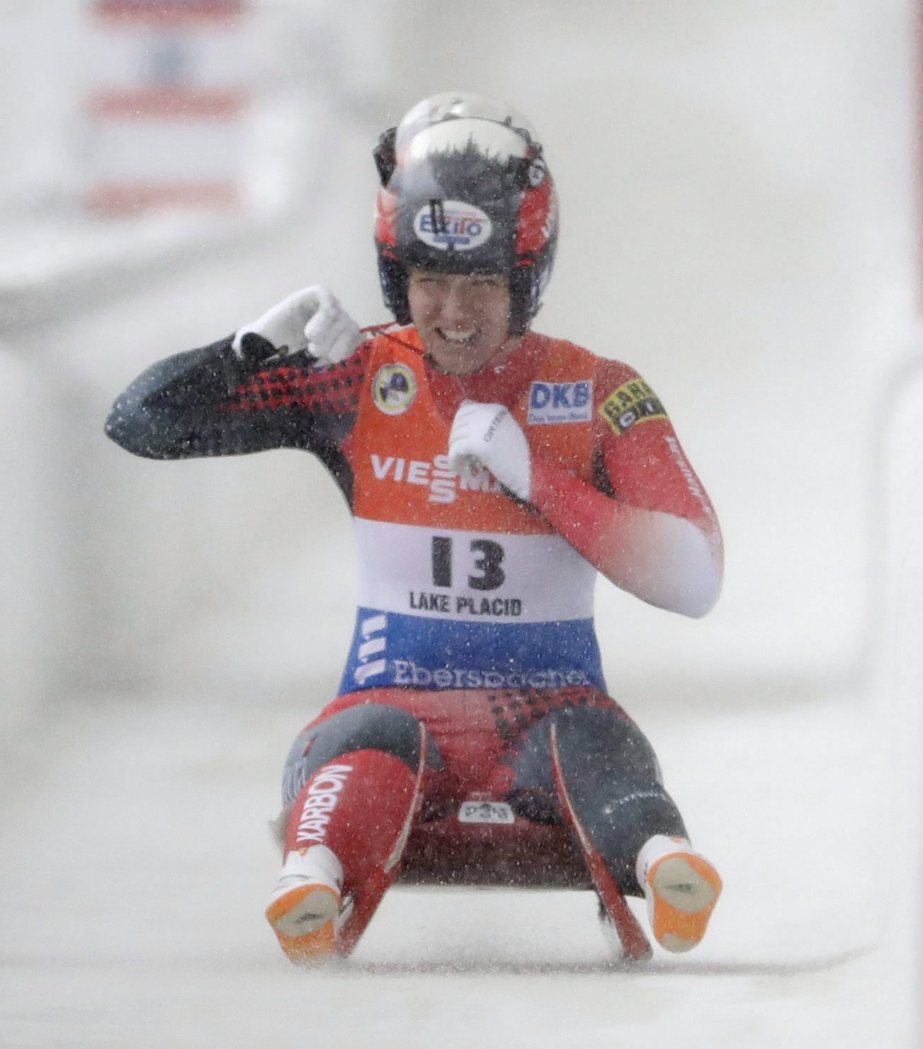 Alex Gough, of Canada, celebrates her third place finish in the women's luge World Cup race on Saturday, Dec. 3, 2016, in Lake Placid, N.Y. (AP Photo/Mike Groll)