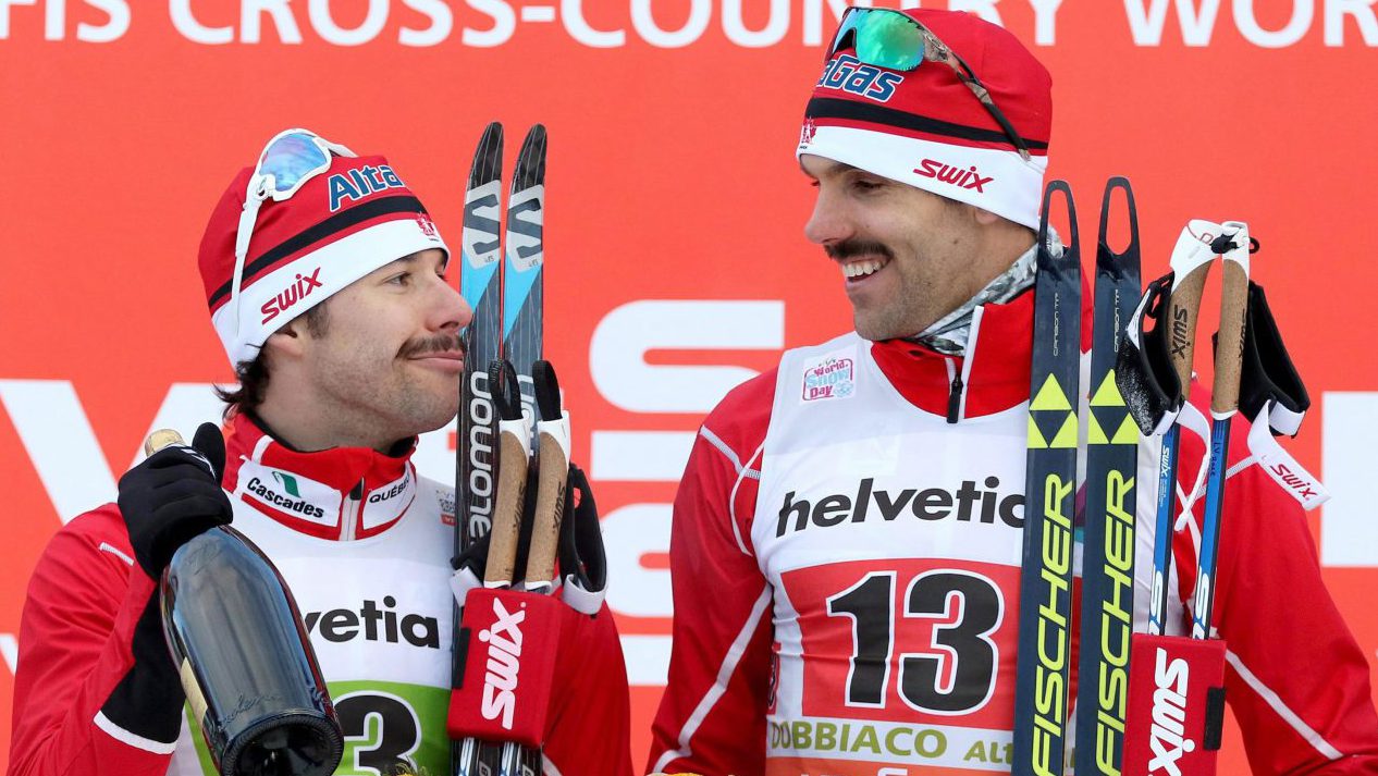 Alex Harvey, left, and Len Valjas of the team Canada celebrate on the podium of the the men's team sprint competition of the FIS Cross Country Skiing World Cup in Dobbiaco (Toblach), Italy, Sunday Jan. 15, 2017. (Andrea Solero/ANSA via AP)