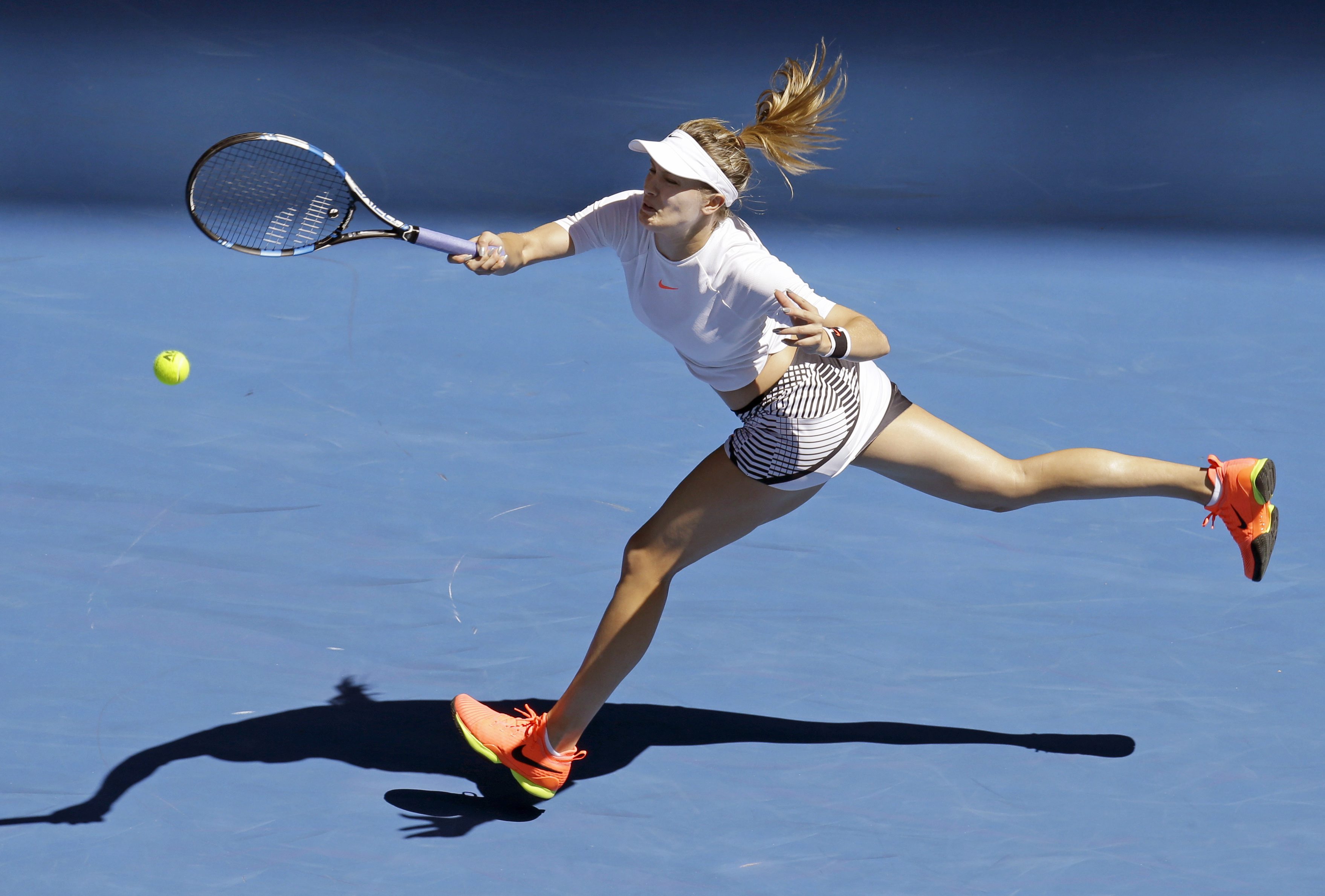 Canada's Eugenie Bouchard stretches for a forehand return to China's Peng Shuai during their second round match at the Australian Open tennis championships in Melbourne, Australia, Wednesday, Jan. 18, 2017. (AP Photo/Aaron Favila)