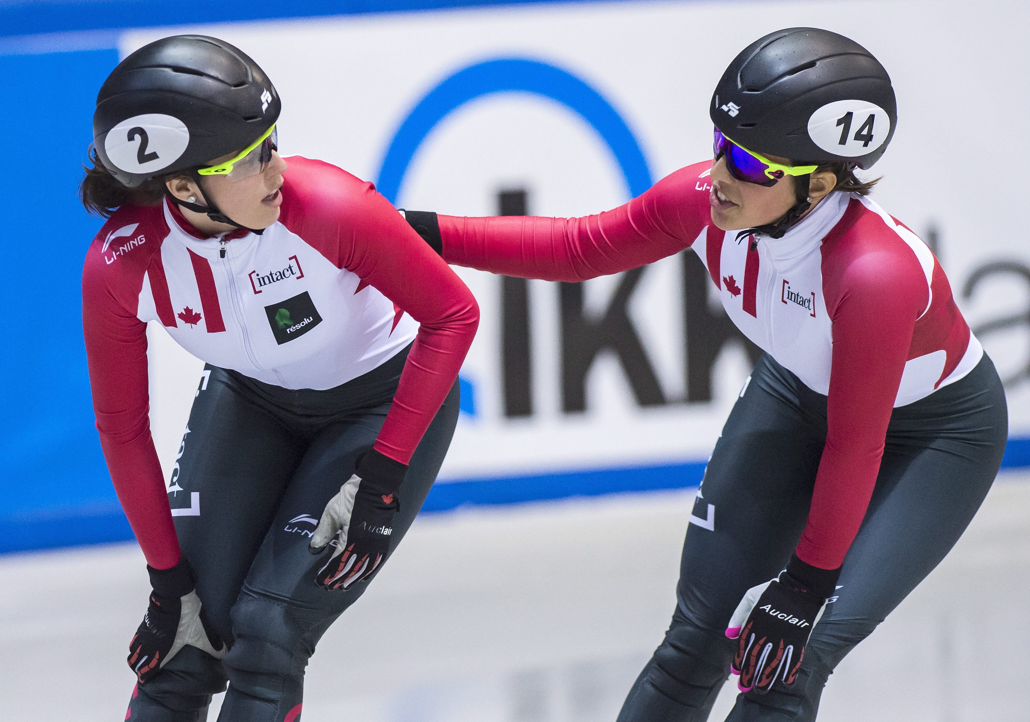 Third placed Valerie Maltais of Canada, right, congratulates winner Marianne St-Gelais of Canada, left, during the women 1000m at the short track speed skating World Cup in Dresden, Germany, Saturday, Feb. 4, 2017. (AP Photo/Jens Meyer)