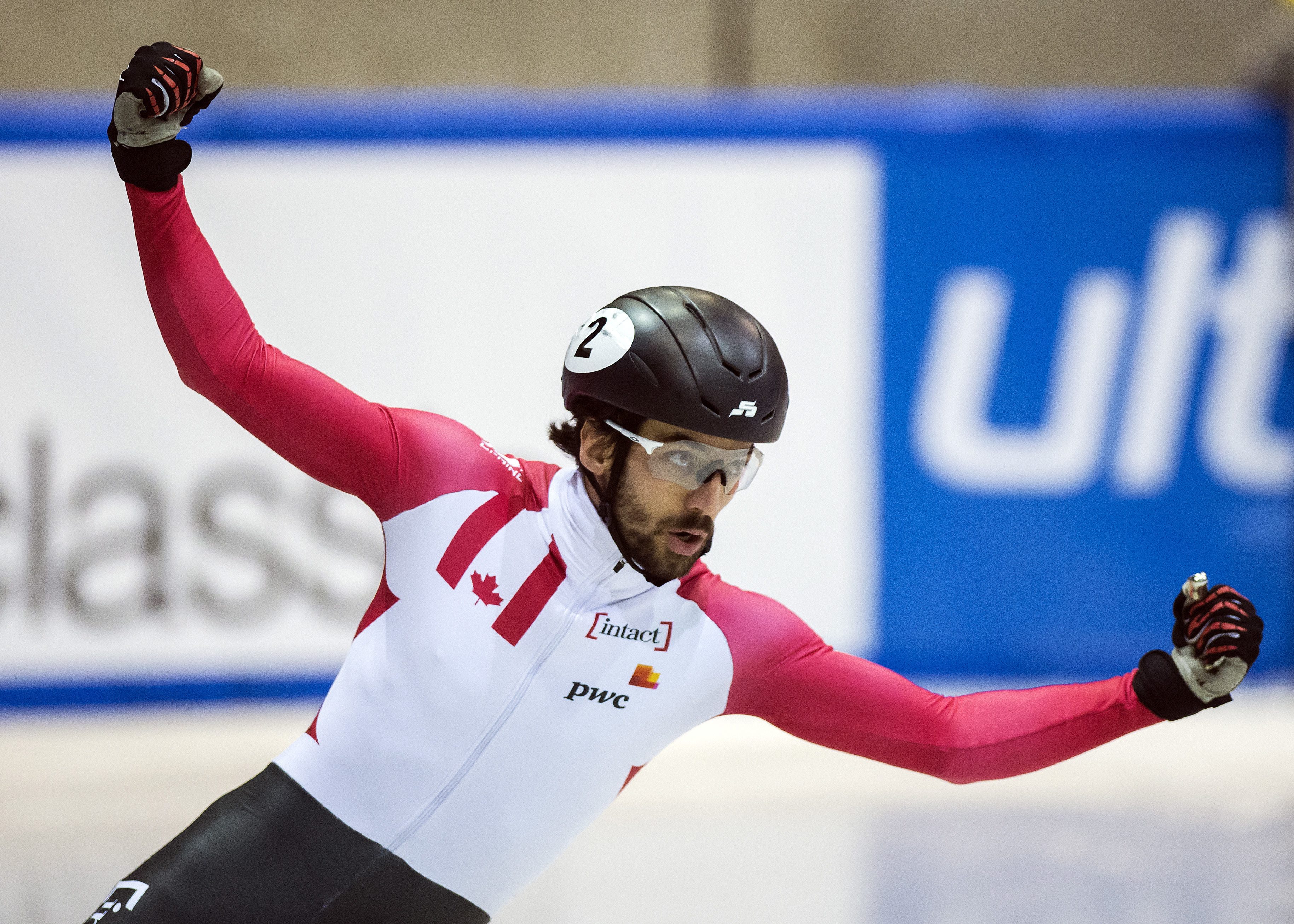 Winner Charles Hamelin of Canada celebrates winning the men's 1500m at the short track speed skating World Cup in Dresden, Germany, Saturday, Feb. 4, 2017. (AP Photo/Jens Meyer)