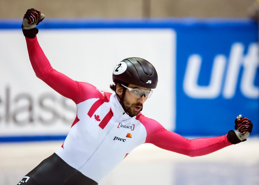 Team Canada - Winner Charles Hamelin of Canada celebrates winning the men's 1500m at the short track speed skating World Cup in Dresden, Germany, Saturday, Feb. 4, 2017. (AP Photo/Jens Meyer)