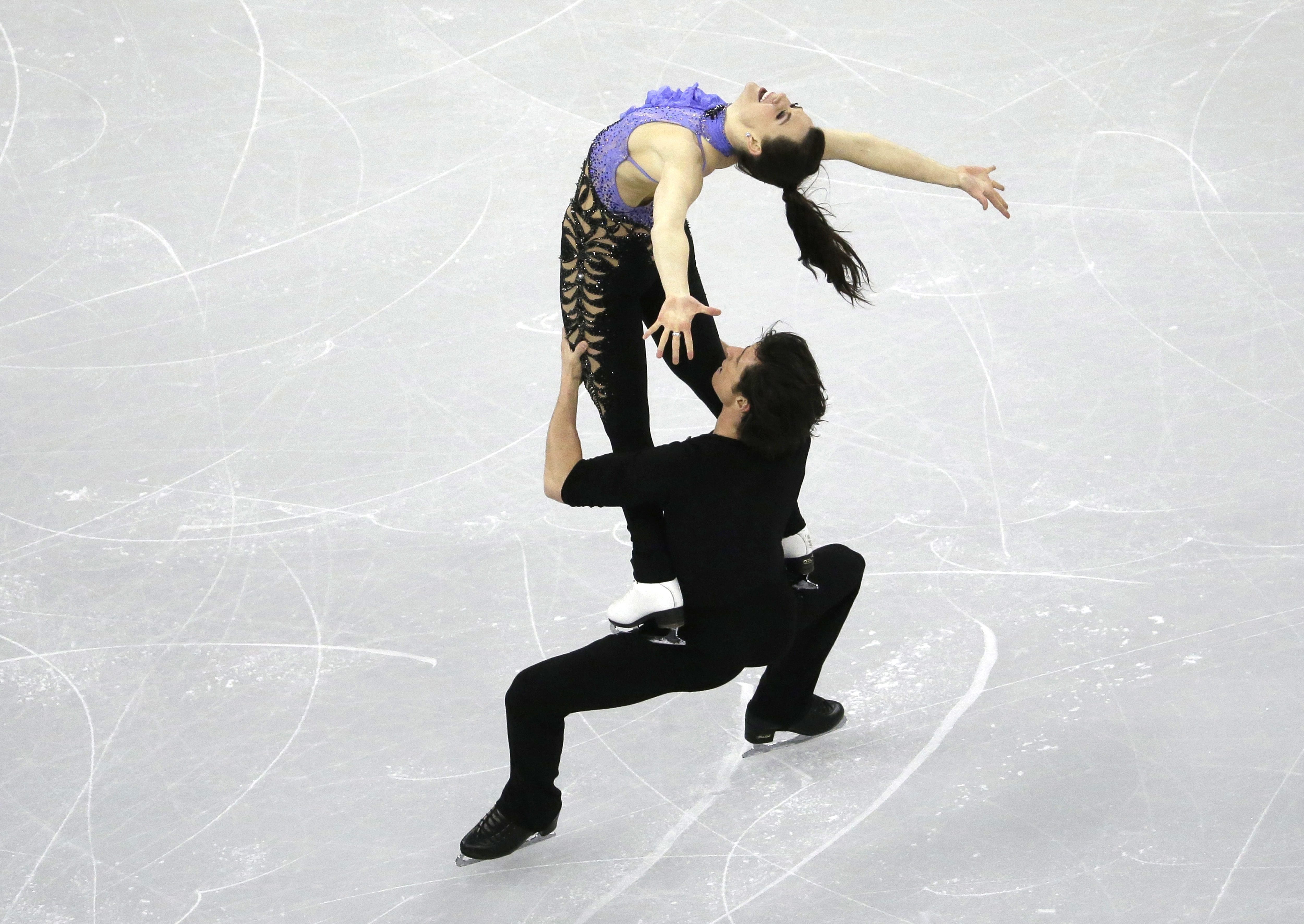 Tessa Virtue and Scott Moir from Canada perform in the Ice Dance Short Dance program at the ISU Four Continents Figure Skating Championships in Gangneung, South Korea, Thursday, Feb. 16, 2017. (AP Photo/Ahn Young-joon)