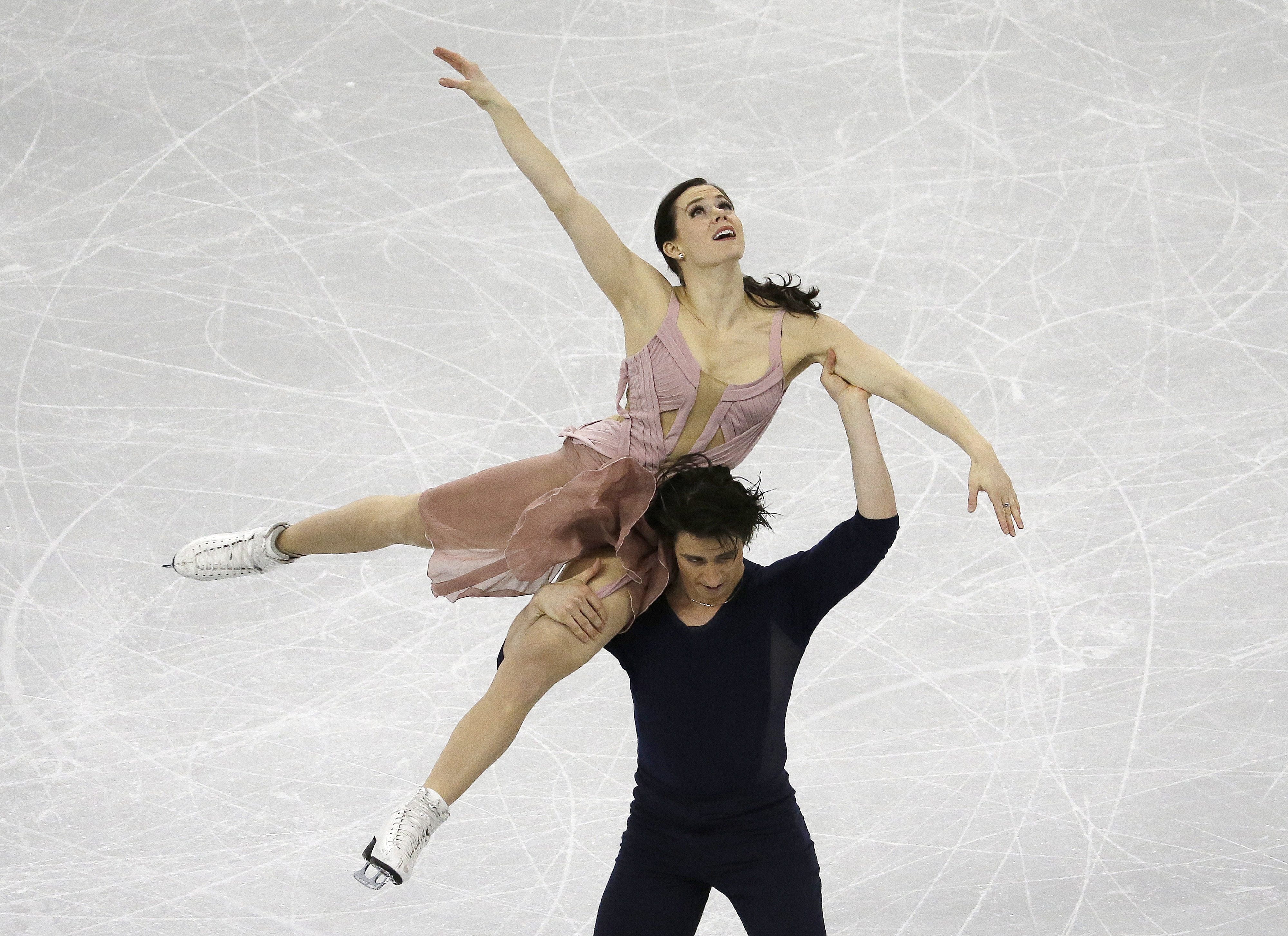 Gold medalists Tessa Virtue and Scott Moir of Canada perform in the Ice Dance Free Dance at the ISU Four Continents Figure Skating Championships in Gangneung, South Korea, Friday, Feb. 17, 2017. (AP Photo/Ahn Young-joon)
