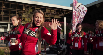 Team Canada athletes waving to the camera