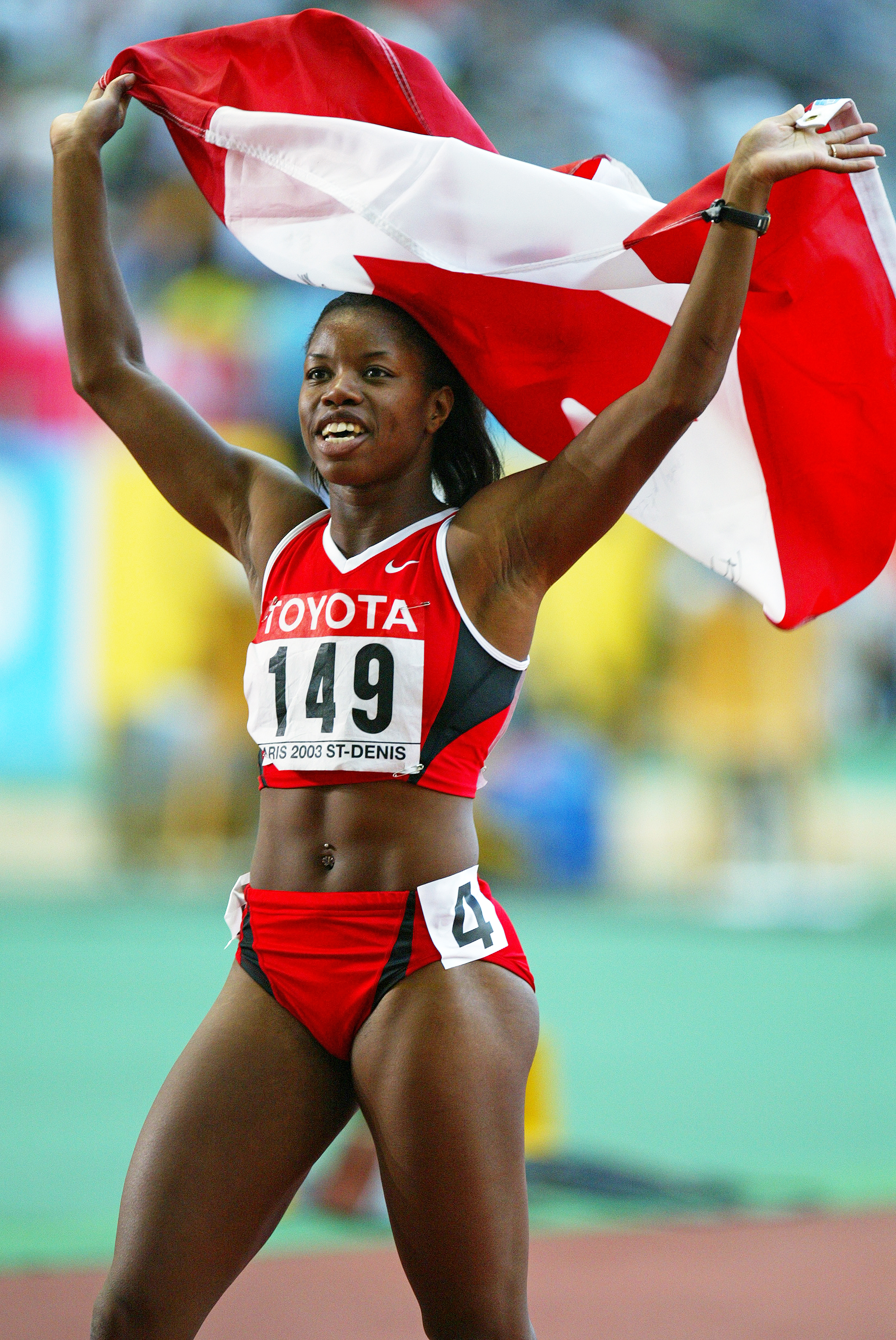 Perdita Felicien celebrates winning gold in the 100m hurdles at the 2003 IAAF World Championships in Paris Photo: Claus Andersen