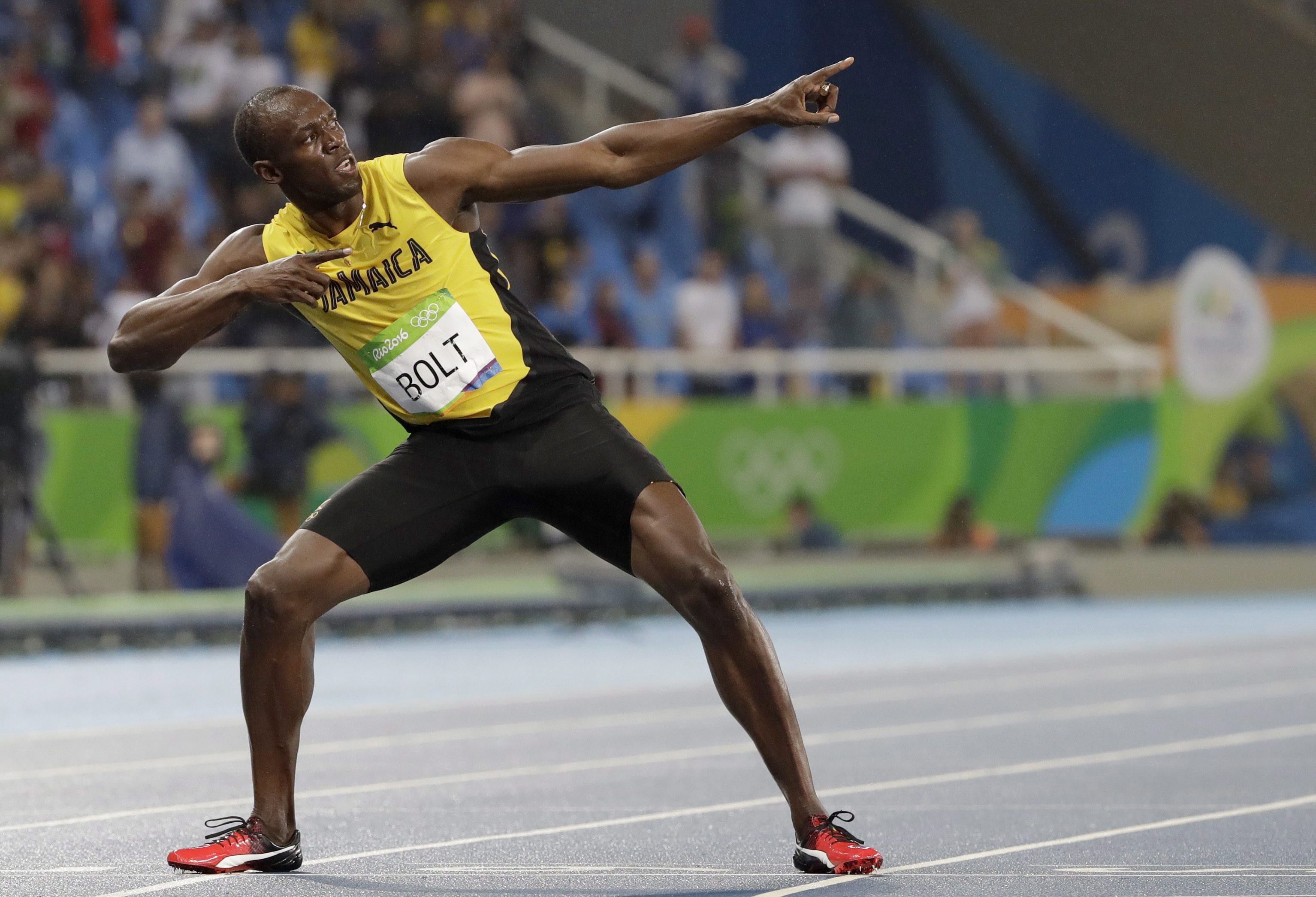 Usain Bolt from Jamaica celebrates winning the gold medal in the men's 200-meter final during the athletics competitions of the 2016 Summer Olympics at the Olympic stadium in Rio de Janeiro, Brazil. (AP Photo/David J. Phillip)