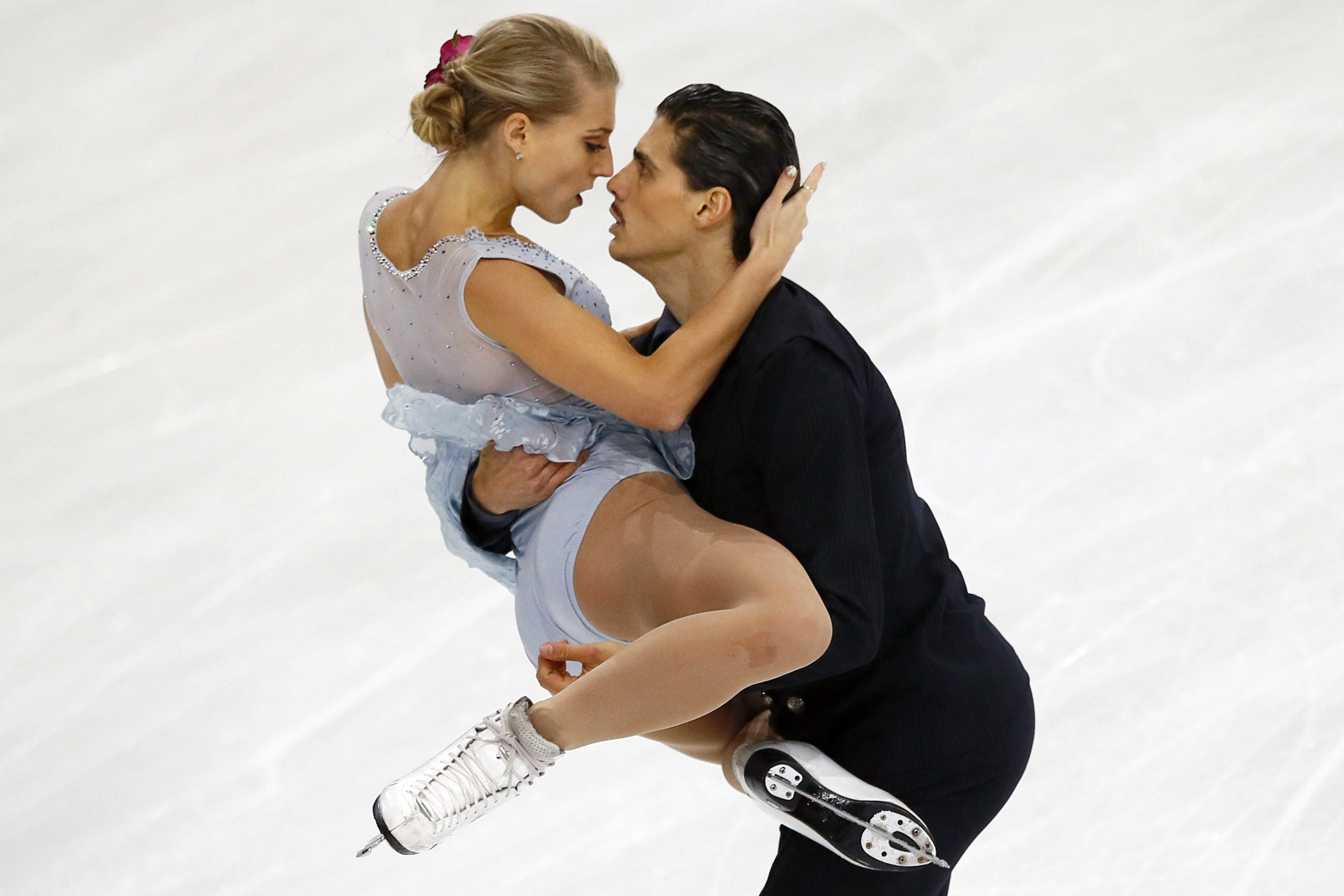 Piper Gilles and Paul Poirier of Canada compete in the Ice Dance Free Dance Program during the ISU figure skating France's Trophy at Bercy arena, in Paris, France, Saturday, Nov. 12, 2016. (AP Photo/Francois Mori)