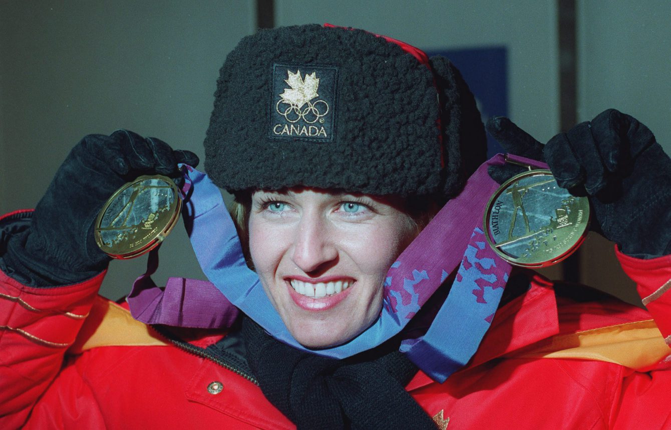 )OLY710) LILLEHAMMER, Canada's Myriam Bedard shows off her two gold medals following the medal ceremony in Lillehammer Wednesday for the Olympic women's 7.5km biathlon. Bedard also won the gold in the 15km event. (CP PHOTO) 1994 (stf-Ron Poling)
