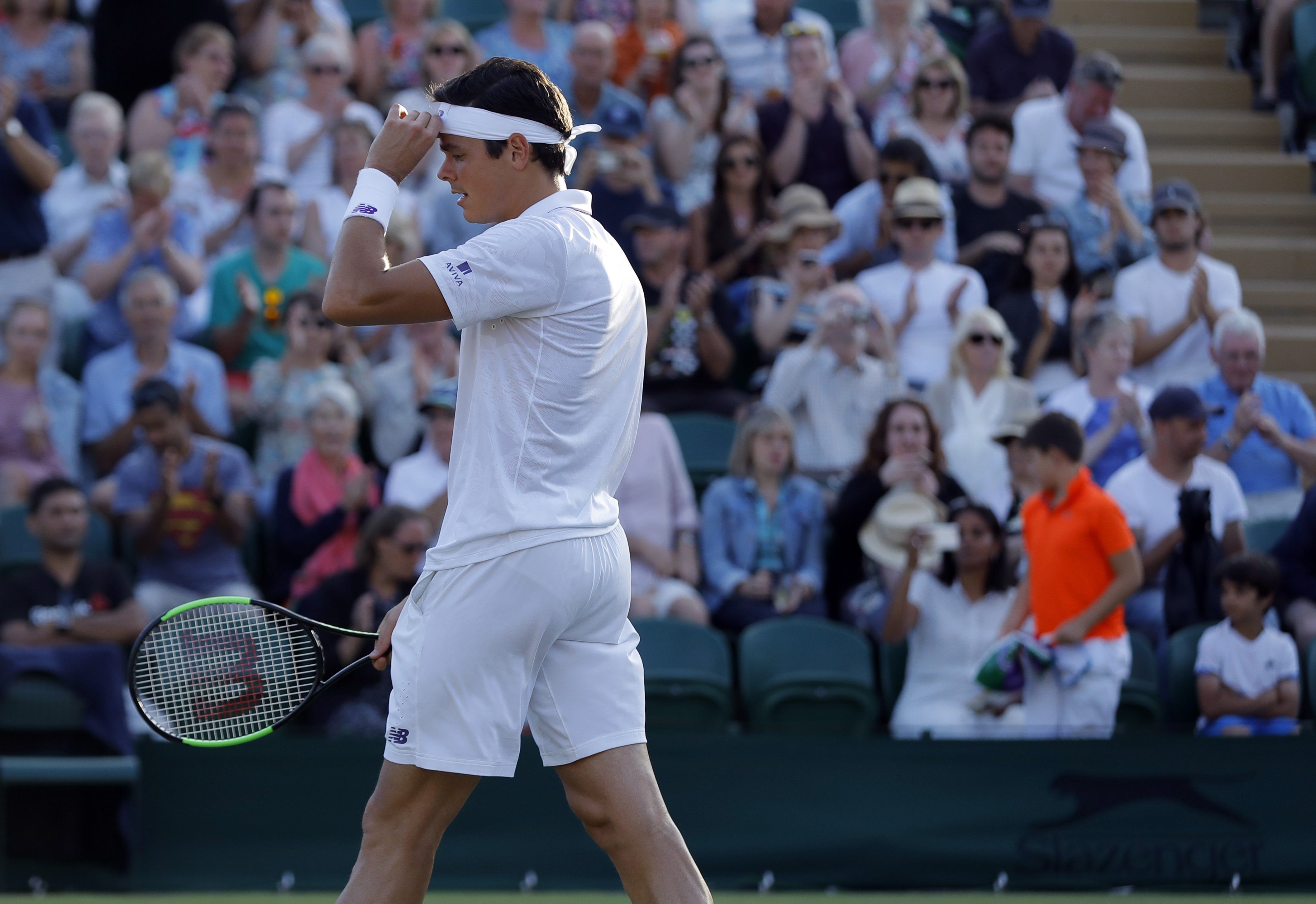 Raonic books return to Wimbledon quarterfinals with comeback victory