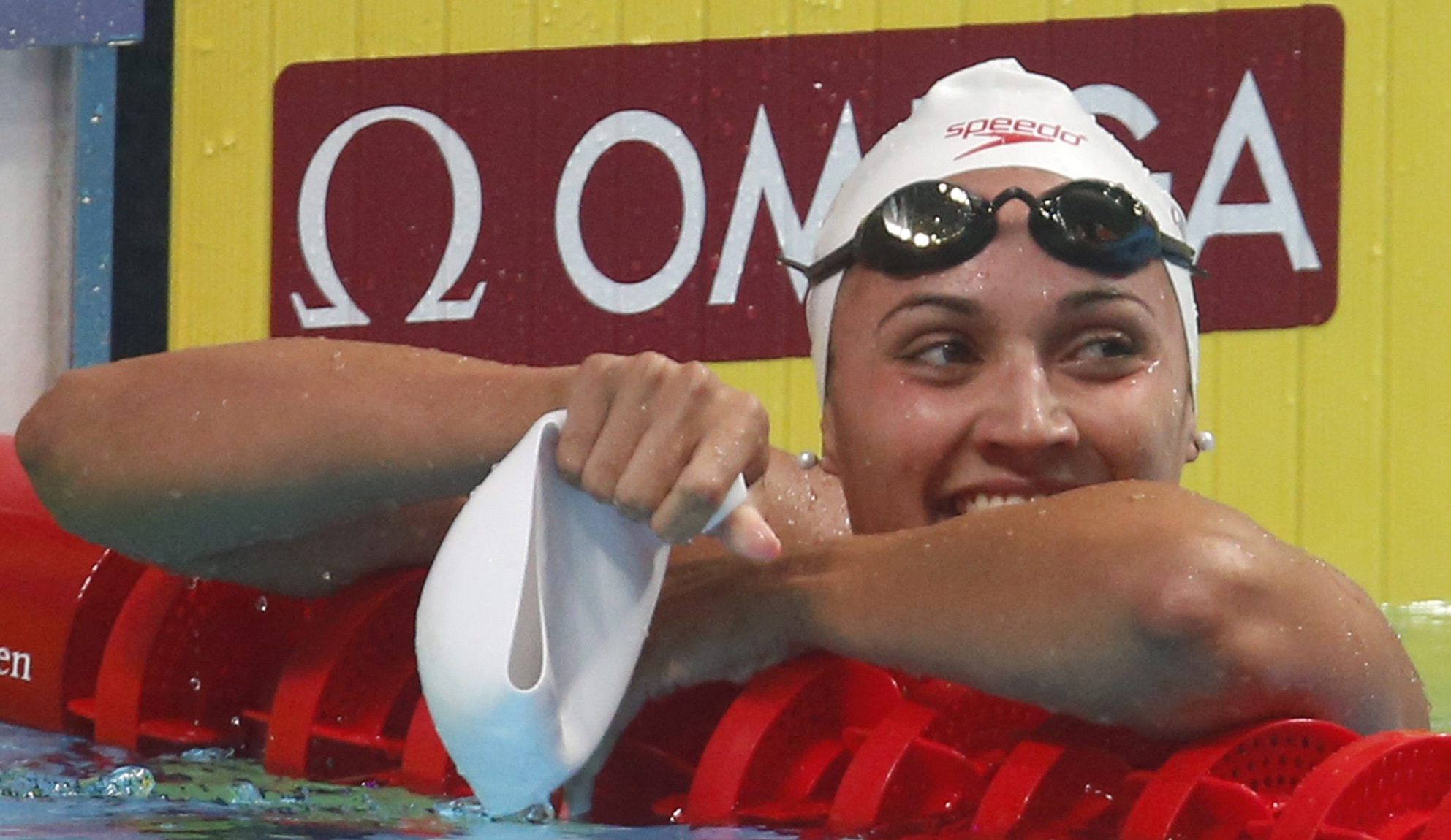 Kylie Masse leaning on lane ropes