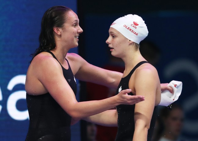 Chantal Van Landeghem hugs Penny Oleksiak on winning bronze in the mixed 4x100m freestyle relay at the 2017 FINA World Championships Photo: Swimming Canada/Ian MacNicol