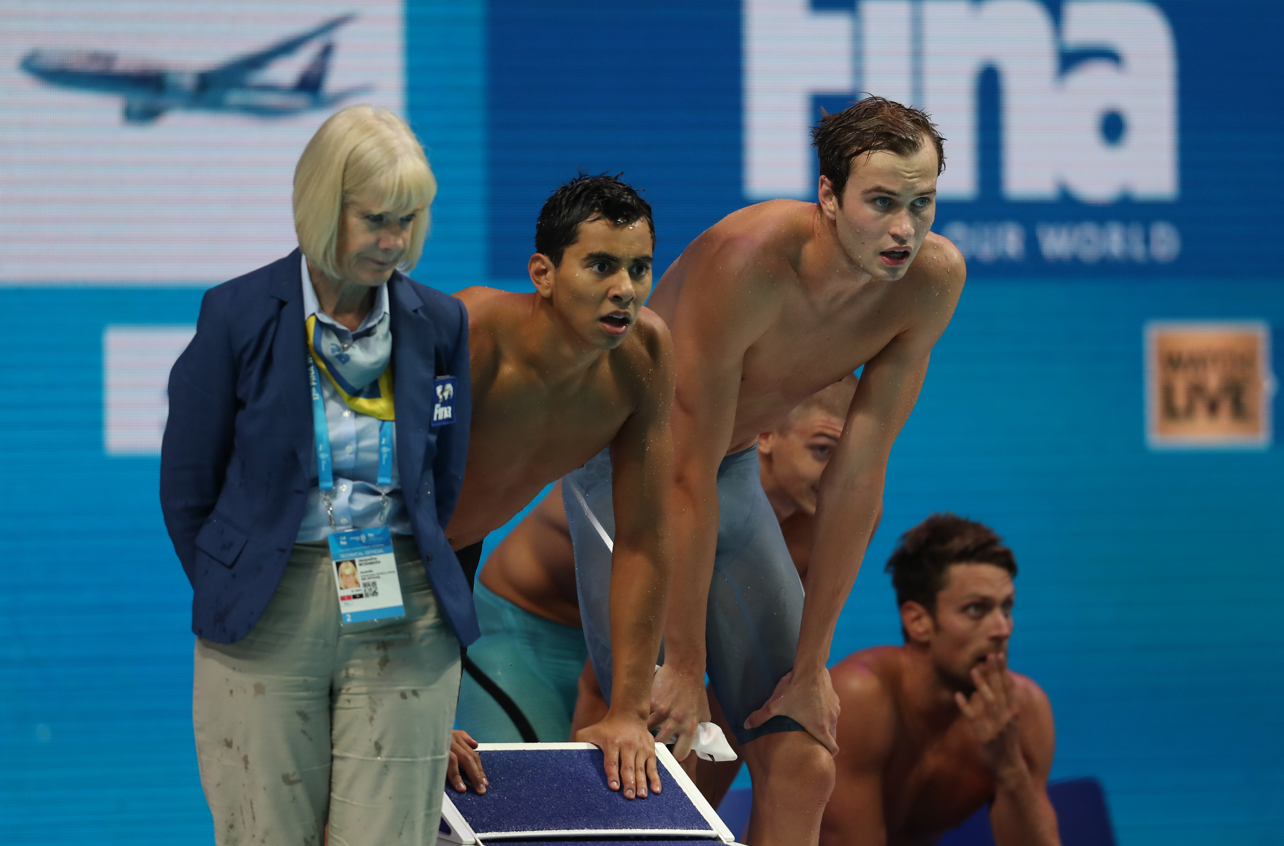 Javier Acevedo and Yuri Kisil watch their teammates race in the mixed 4x100m freestyle relay at the 2017 FINA World Championships Photo: Swimming Canada/Ian MacNicol