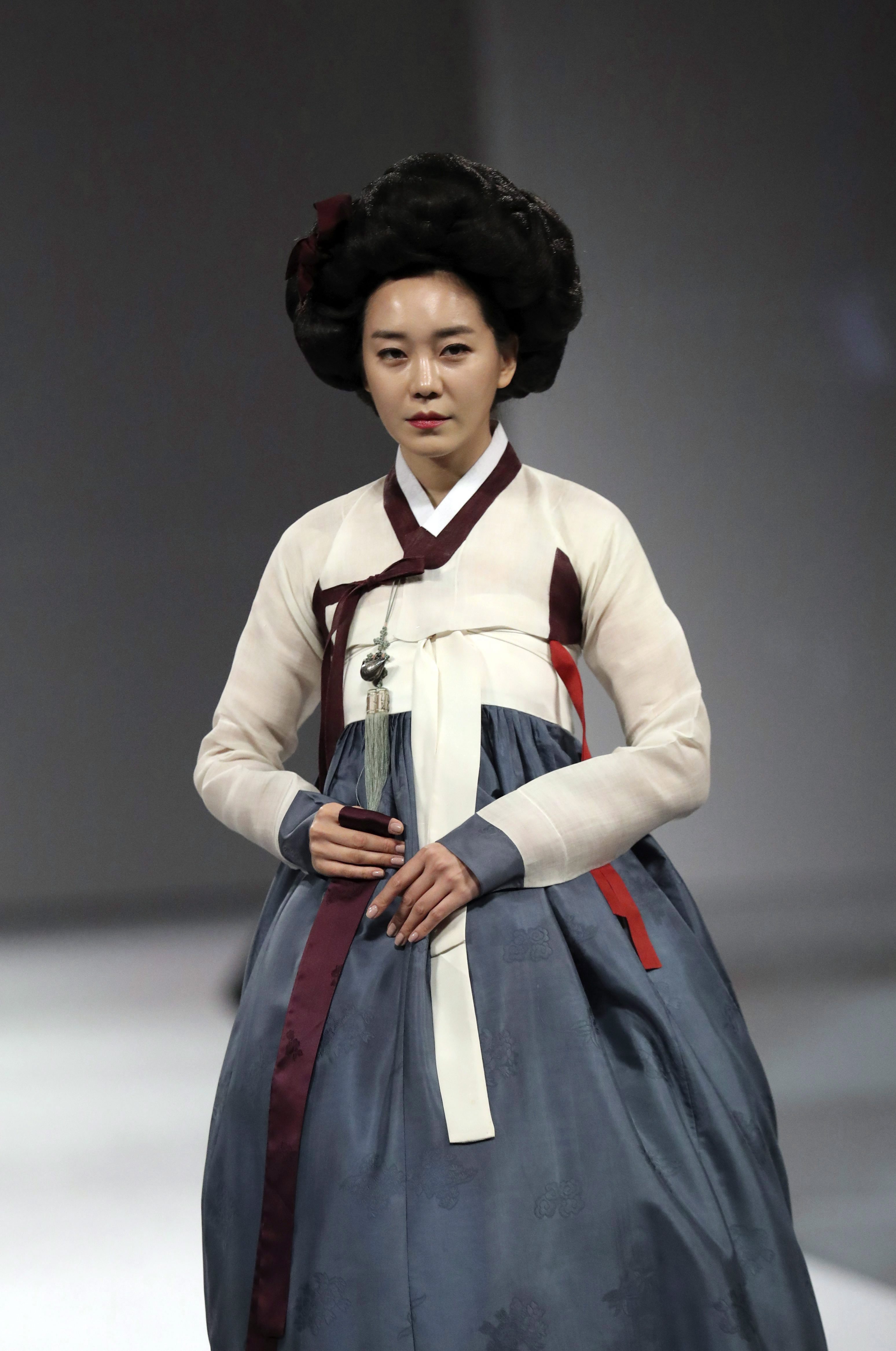 A model wears a traditional South Korean "Hanbok" dress