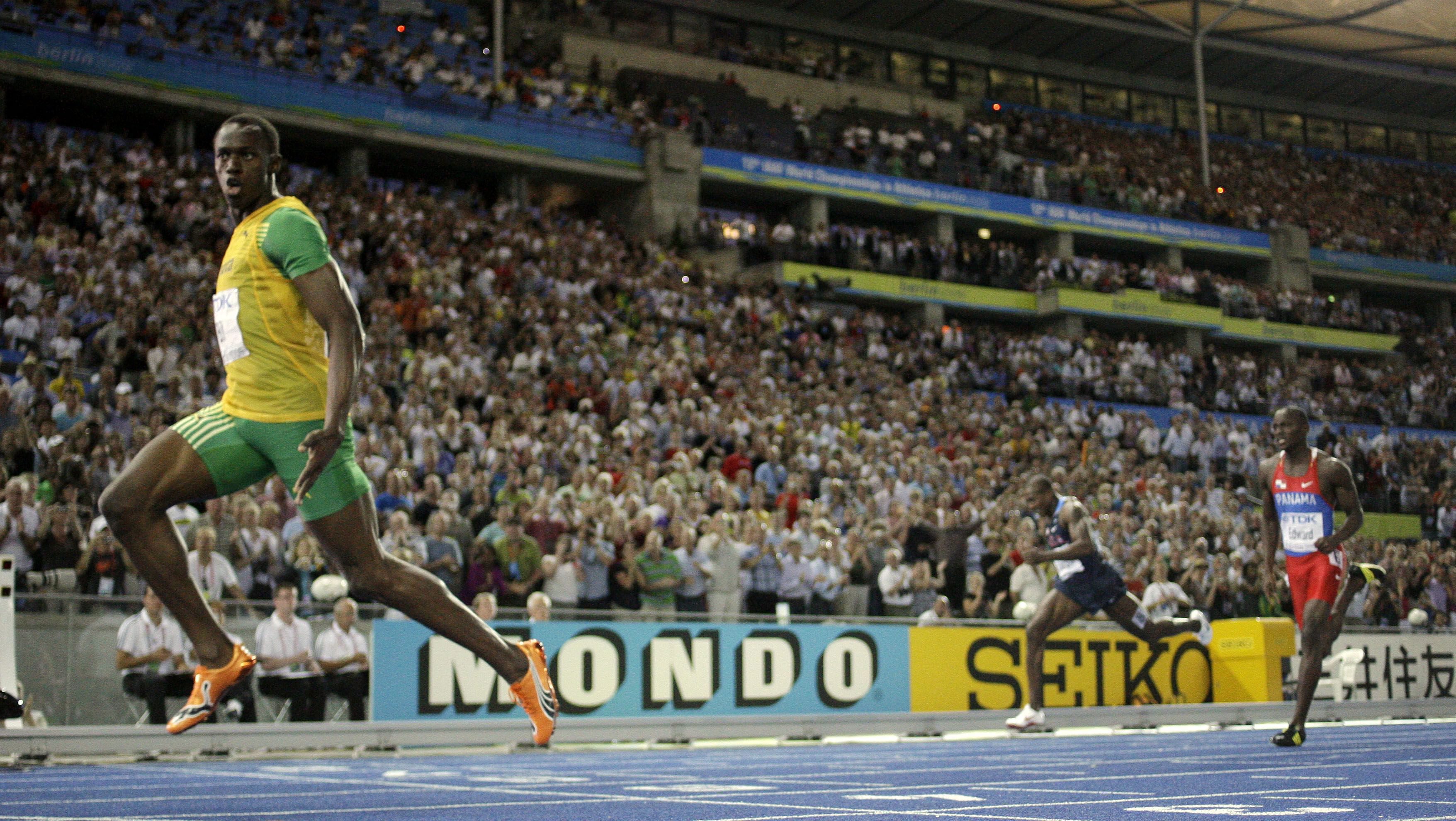 Usain Bolt crosses the finish line to setting a new World Record as he wins the Men's 200m final during the World Athletics Championships in Berlin, 2009