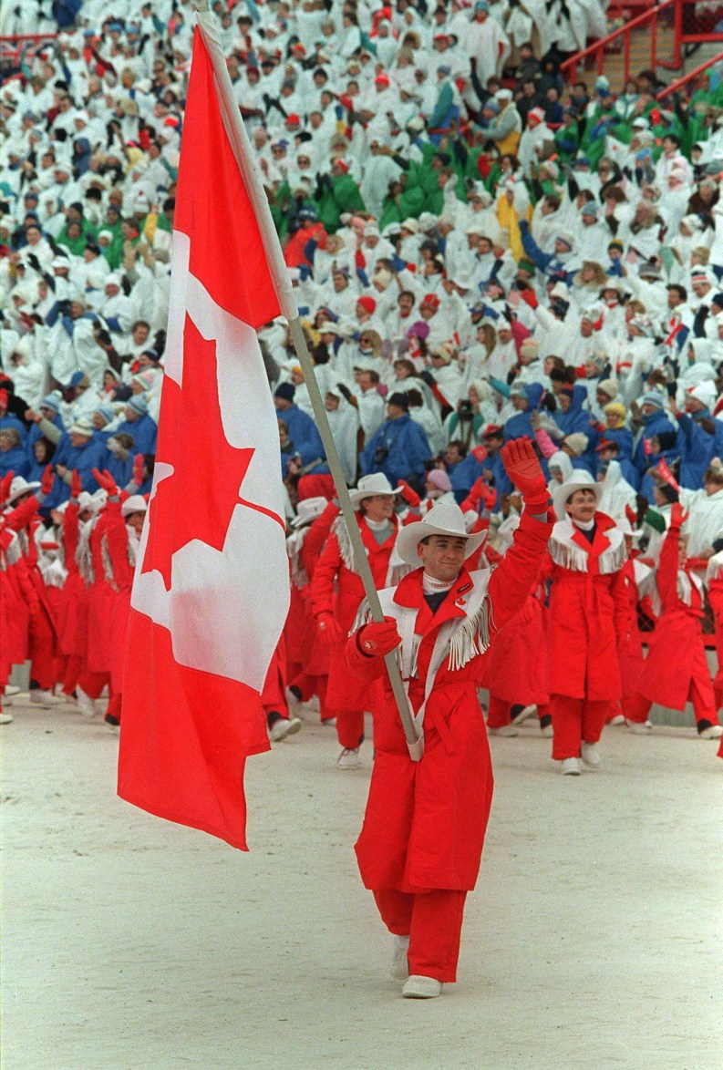 Brian Orser carries Canadian flag into Calgary 1988 Opening Ceremony
