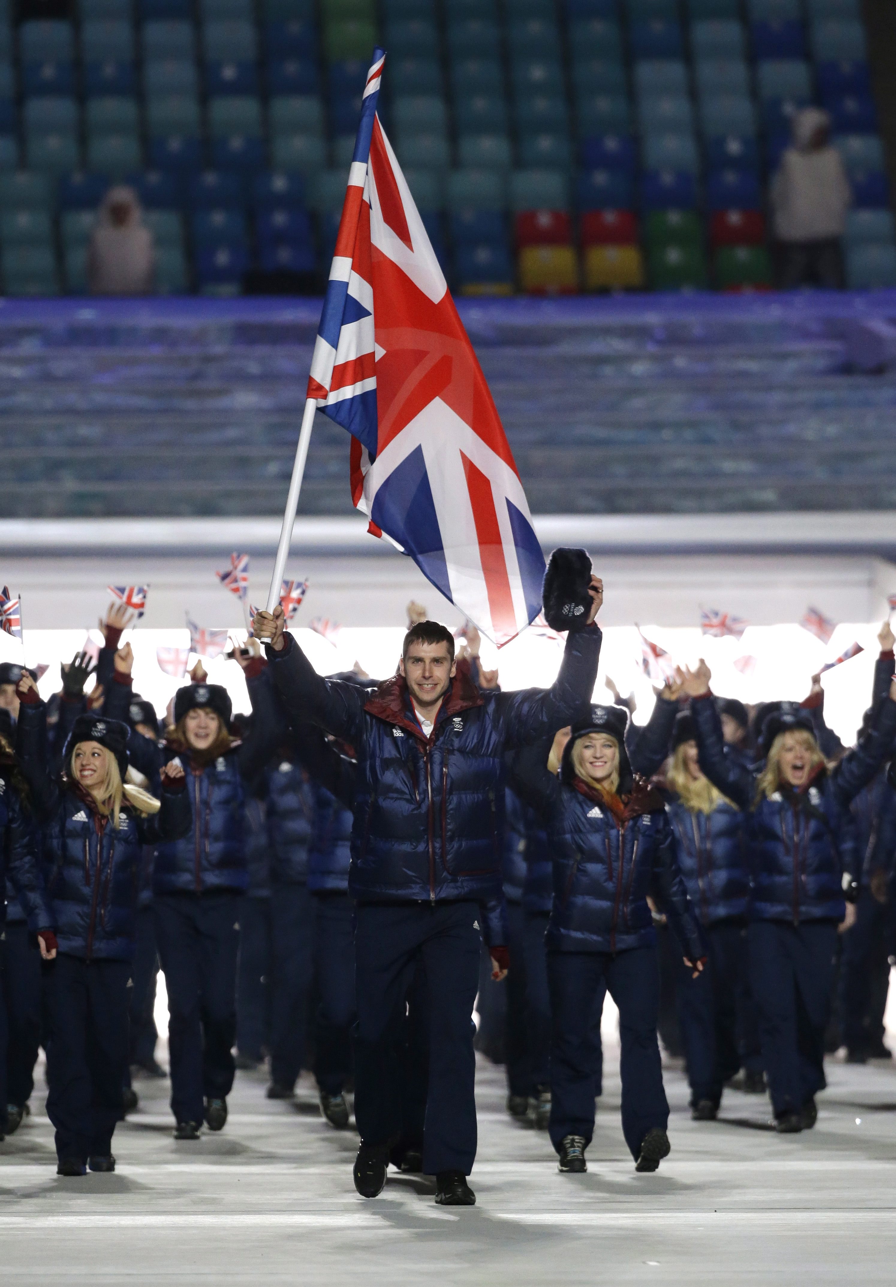 Jon Eley of Britain carries the national flag as he leads the team during the opening ceremony of the 2014 Olympic Winter Games in Sochi, Russia, Friday, Feb. 7, 2014. (AP Photo/Mark Humphrey)