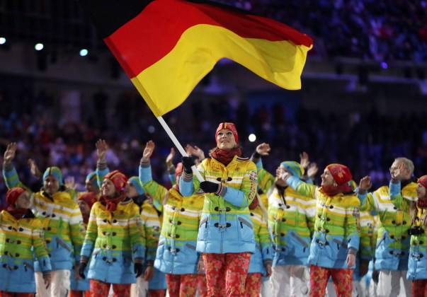 Maria Hoefl-Riesch of Germany carries her country flag as the team arrives during the opening ceremony of the 2014 Olympic Winter Games in Sochi, Russia, Friday, Feb. 7, 2014. (AP Photo/Matt Dunham)