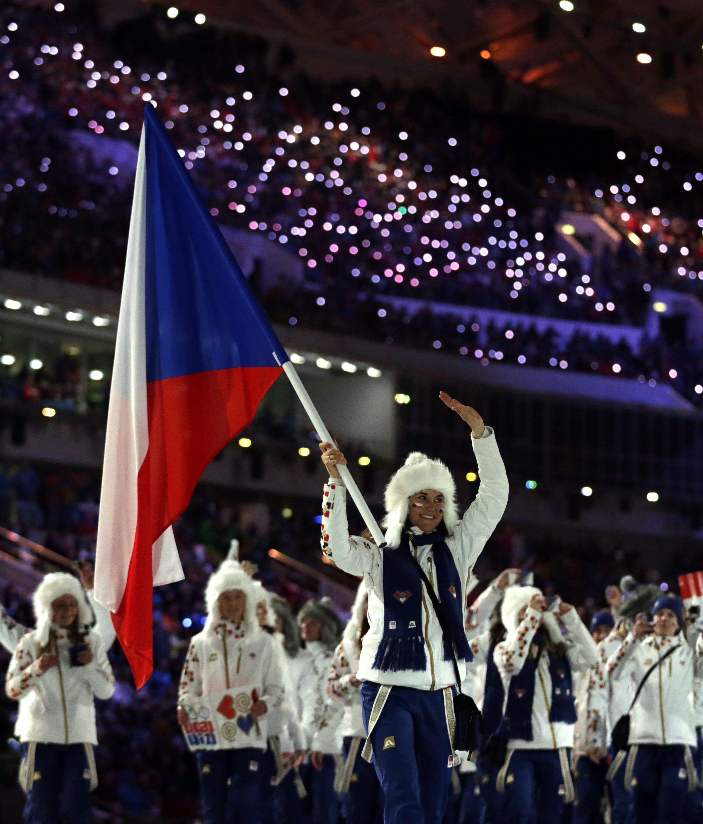 Sarka Strachova of the Czech Republic carries the national flag during the opening ceremony of the 2014 Olympic Winter Games in Sochi, Russia, Friday, Feb. 7, 2014. (AP Photo/Matt Dunham)