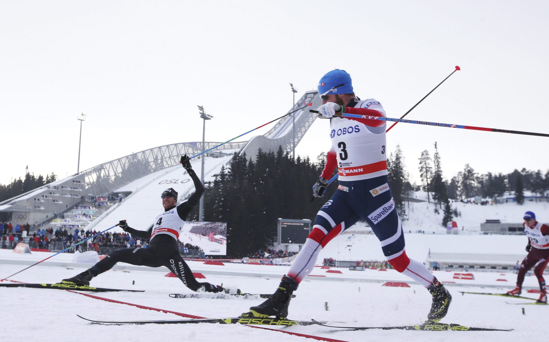 Dario Cologna of Switzerland, left, finishes first ahead of Martin Johnsrud Sundby of Norway, second, in the FIS World Cup Cross Country Men's 50 km Mass Start in Holmenkollen, Norway Saturday, March 10, 2018. (Berit Roald/NTB scanpix via AP)