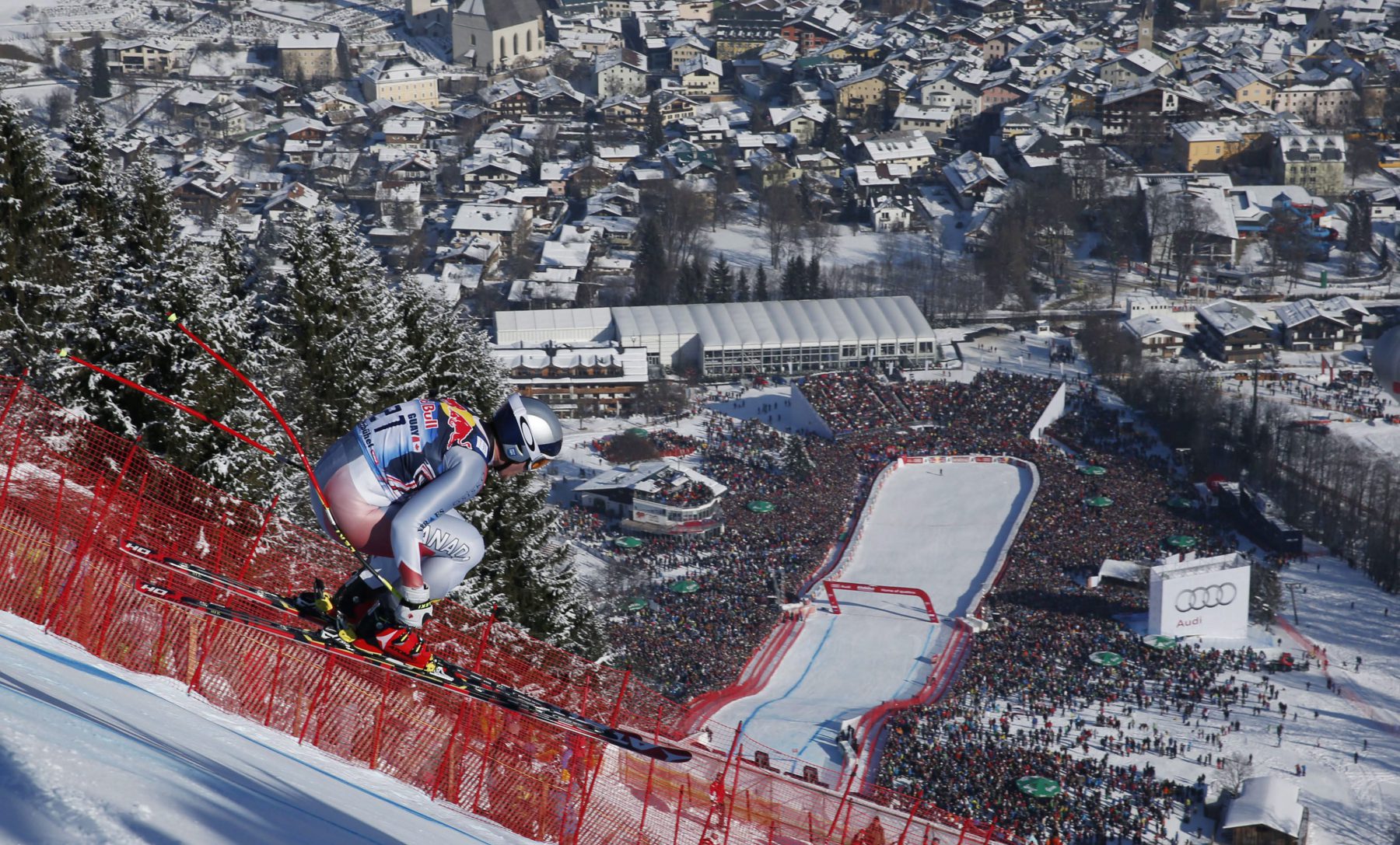 Canada's Erik Guay speeds down the course on his way to take second place in an alpine skiing men's World Cup downhill, in Kitzbuehel, Austria, Saturday, Jan. 26, 2013. (AP Photo/Shinichiro Tanaka)