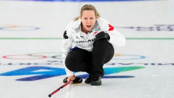 Rachel Homan competes in curling.