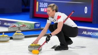 Emma Miskew competes in curling.