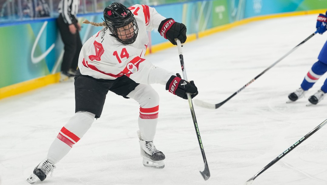 Renata Fast competes in ice hockey.