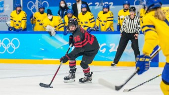 Emily Clark stickhandles the puck against Sweden
