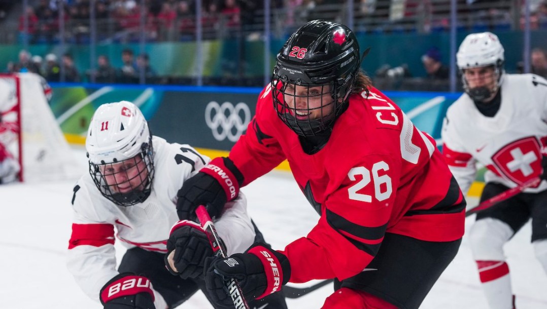 Emily Clark competes in ice hockey.