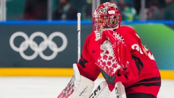 Ann-Renée Desbiens competes in ice hockey.