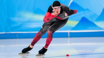 Ted-Jan Bloemen skates a turn in a speed skating race