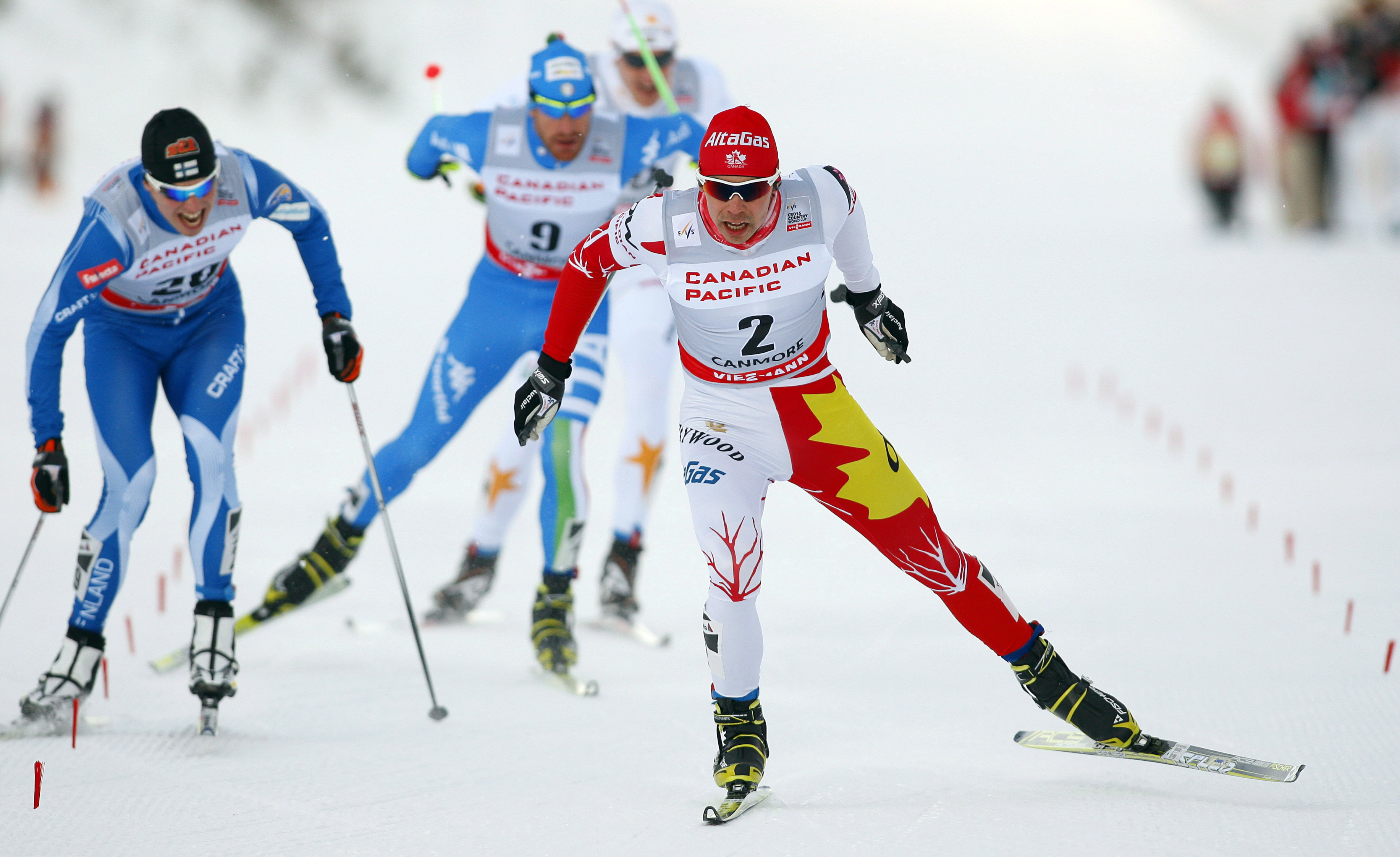 Jesse Cockney skiing with competitors trailing behind him
