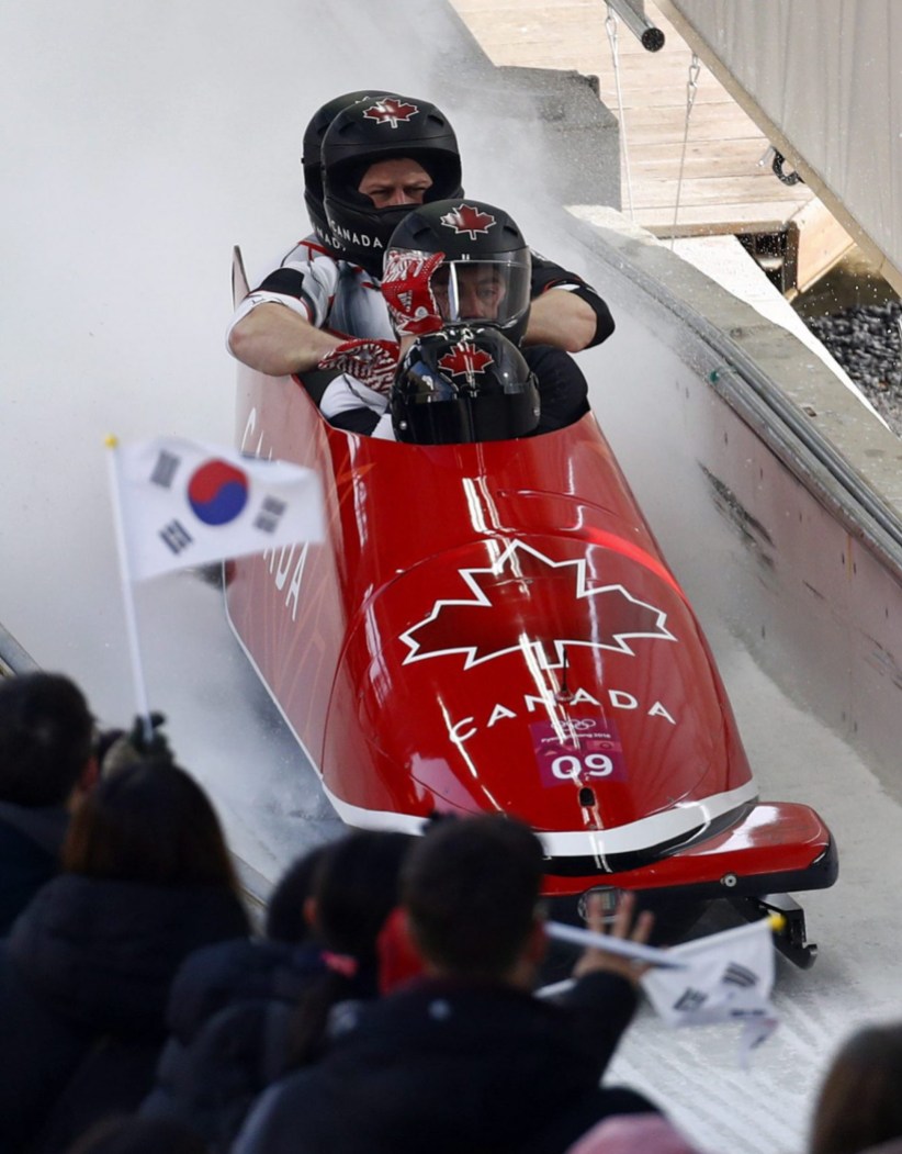 Pyeongchang Olympics Bobsled Driver Justin Kripps, Jesse Lumsden, Alexander Kopacz and Oluseyi Smith of Canada finish their third heat during the four-man bobsled competition final at the 2018 Winter Olympics in Pyeongchang, South Korea, Sunday, Feb. 25, 2018. (AP Photo/Patrick Semansky)