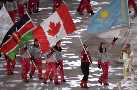 Canadian short-track speed skater Kim Boutin leads team Canada into the Olympic stadium carrying the Canadian flag during the closing ceremonies at the 2018 Pyeongchang Olympic Winter Games in Pyeongchang, South Korea, on Sunday, February 25, 2018. THE CANADIAN PRESS/Paul Chiasson