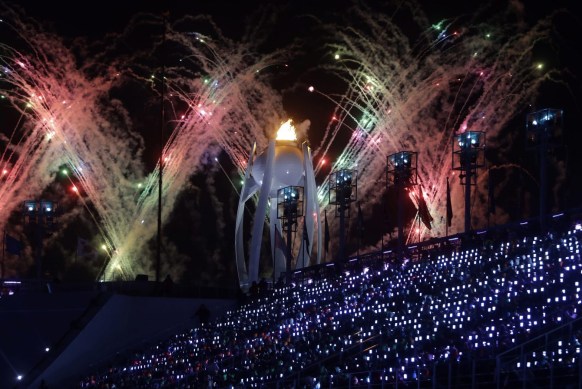 APTOPIX Pyeongchang Olympics Closing Ceremony Fireworks explode over the Olympic flame during the closing ceremony of the 2018 Winter Olympics in Pyeongchang, South Korea, Sunday, Feb. 25, 2018. (AP Photo/Michael Probst)
