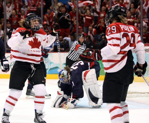 Meghan Agosta celebrates with Marie-Philip Poulin