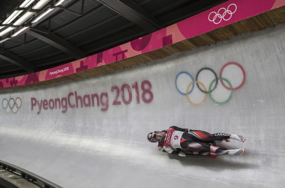 Tristan Walker and Justin Snith compete in the men's Luge doubles