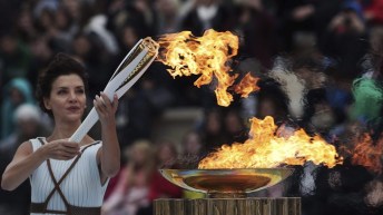 Actress playing the role of high priestess lights the Pyeongchang Olympic torch