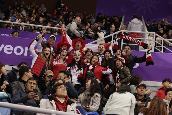 Team Canada fans cheer on pairs figure skating at PyeongChang 2018.