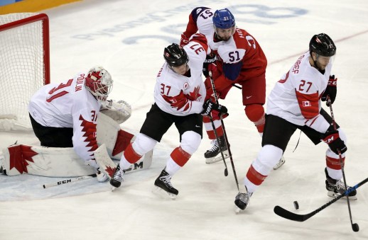 _JR_7011 Mat Robinson and Cody Goloubef of Canada battle for the puck in the Men's Bronze Medal hockey game against the Czech Republic at the Gangneung Hockey Centre during the PyeongChang 2018 Olympic Winter Games in PyeongChang, South Korea on February 24, 2018. (Photo by Vaughn Ridley/COC)