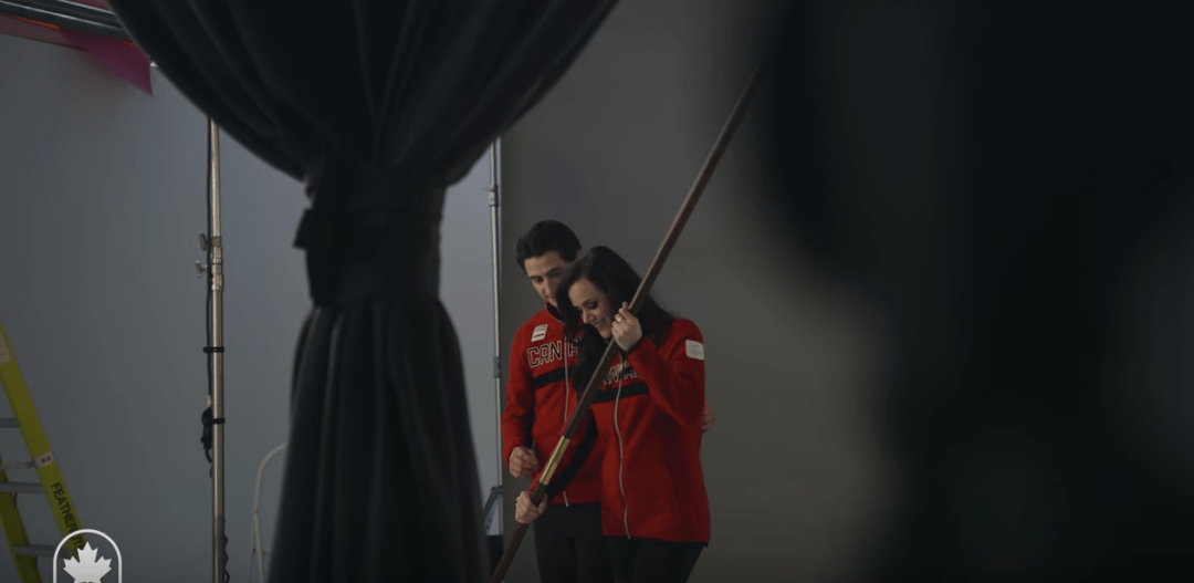 Tessa and Scott holding the flag