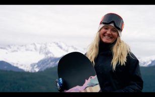 Mercedes Nicoll posing with her snowboard