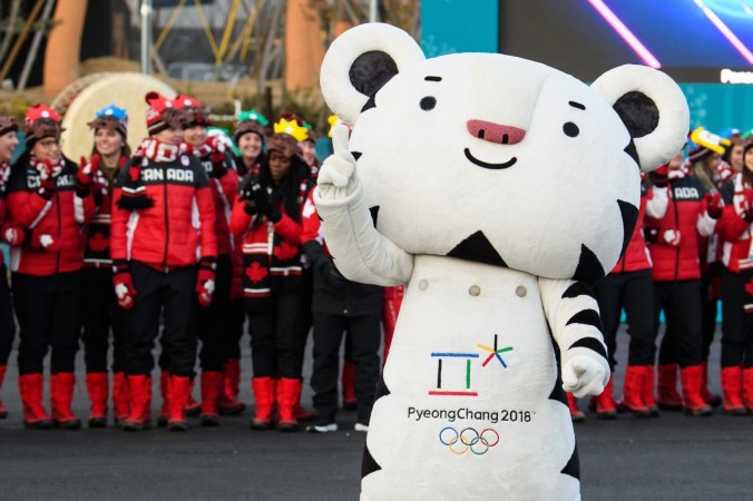 Team Canada posing with the Pyeong Chang mascot