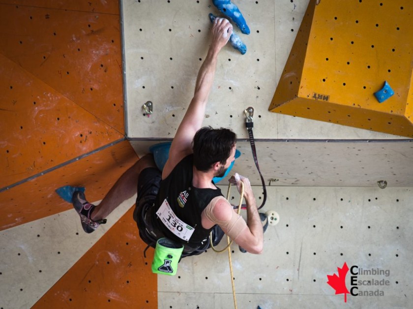Jason Holowach competes in lead climbing