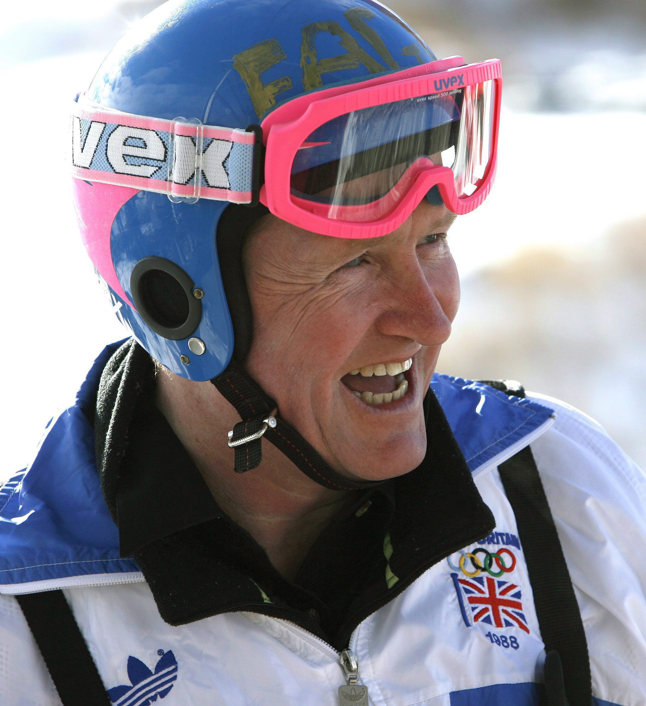 Former Olympic ski jumper Eddie "the Eagle" Edwards, from Britain, laughs after a ride from the 90 metre ski jump tower to commemorate the 20th anniversary start of the 1988 Olympics in Calgary, Alberta on Feb. 13, 2007. (THE CANADIAN PRESS/Larry MacDougal)