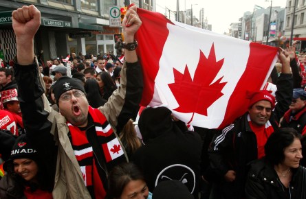 Canadian fans celebrate their gold medal victory against the United States in the final hockey match at the Vancouver 2010 Olympics, in downtown Vancouver, British Columbia, Sunday, Feb. 28, 2010. (AP Photo/Chris Carlson)