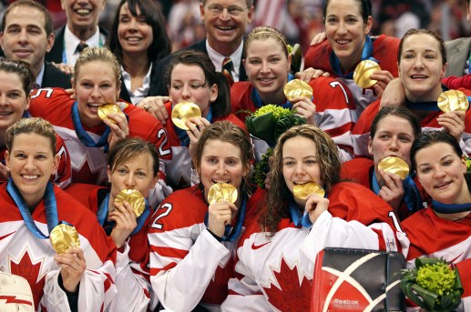 Team Canada celebrates with their gold medals Thursday, Feb. 25, 2010 after defeating the USA 2-0 in the women's gold medal final ice hockey at the 2010 Winter Olympic Games in Vancouver. THE CANADIAN PRESS/Jonathan Hayward