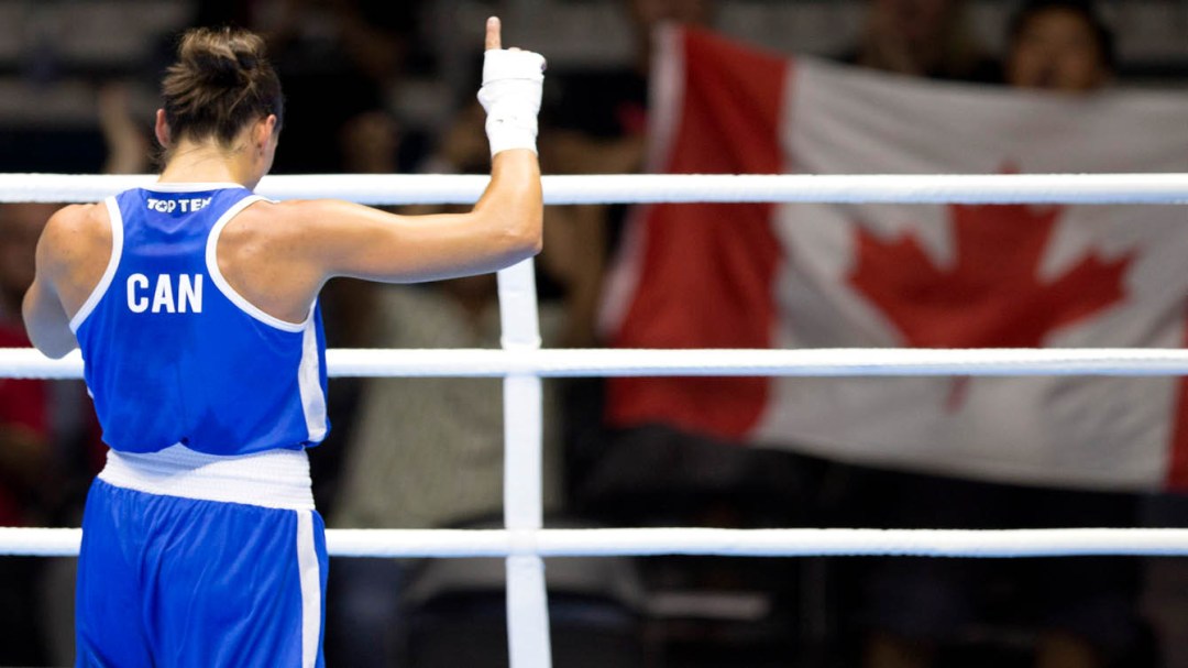 Boxer celebrating with Canadian flag in background